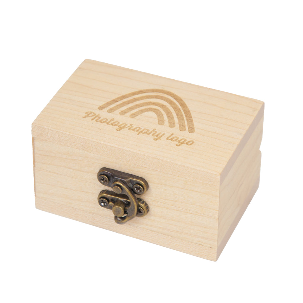 Light wood treasure box engraved with a logo